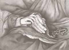 hand of a child on the hand of a elder who holds rosary